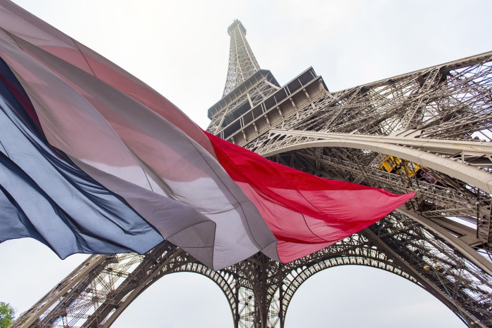 French flag under Eiffel Tower