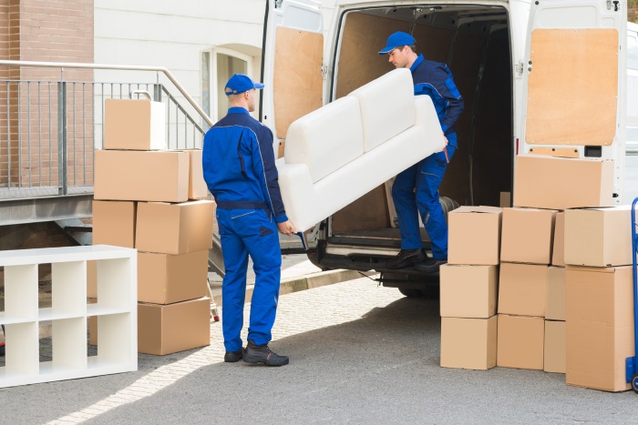 Unloading sofa from a van